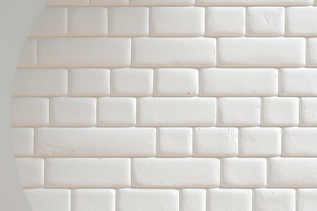 una pared de ladrillo blanco con un fondo de textura blanca.