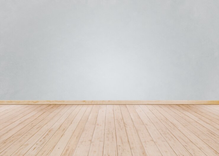 Pared de ladrillo blanco con piso de madera