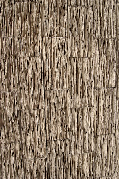 Pared de ladrillo cubierta con textura de yeso Patrón de madera