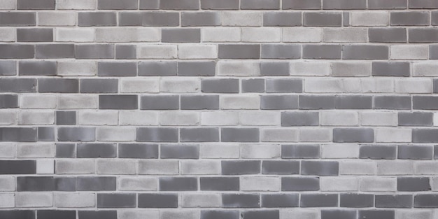 Una pared de ladrillo gris con un patrón de ladrillo blanco y gris.