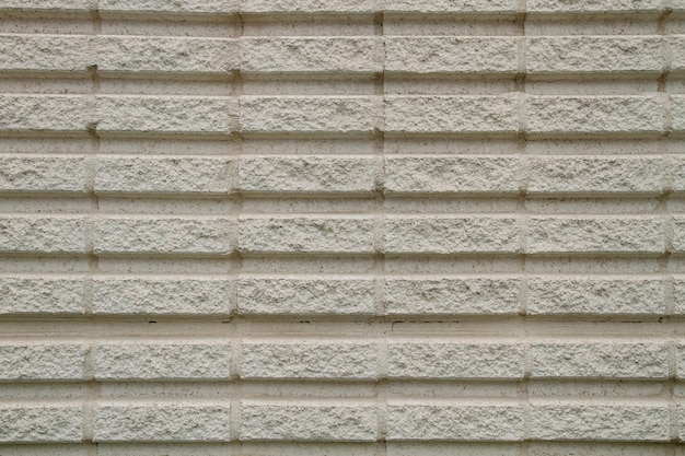 Una pared de ladrillo con un patrón de textura blanca.