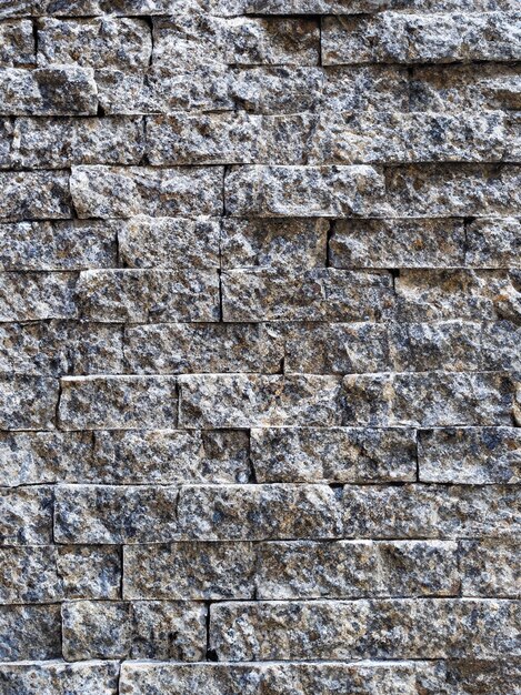 Foto pared de ladrillo de piedra moderna con textura de piedra de fondo