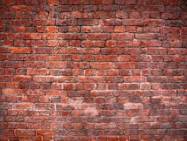 Pared de ladrillo rojo en el fondo de ladrillo de estilo vintage