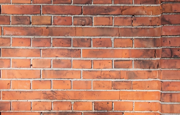 Pared de ladrillo rojo con sombra