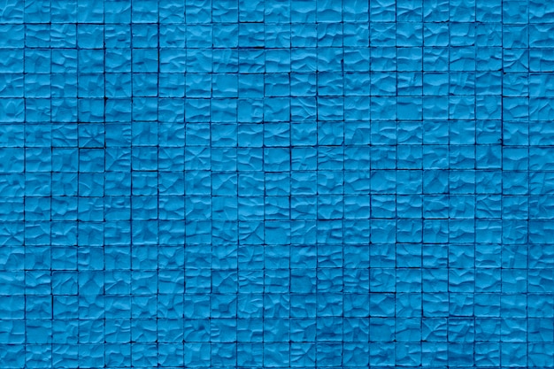 Pared de piedra . Paredes de piedra envejecidas de la arena para el fondo de la textura y del diseño. Color azul de moda del año.