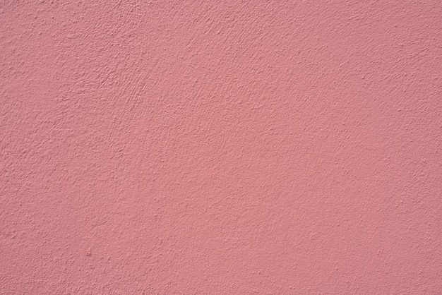 Pared de textura de estuco rosa del edificio