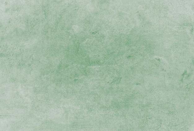 Una pared de textura verde con un fondo verde claro.