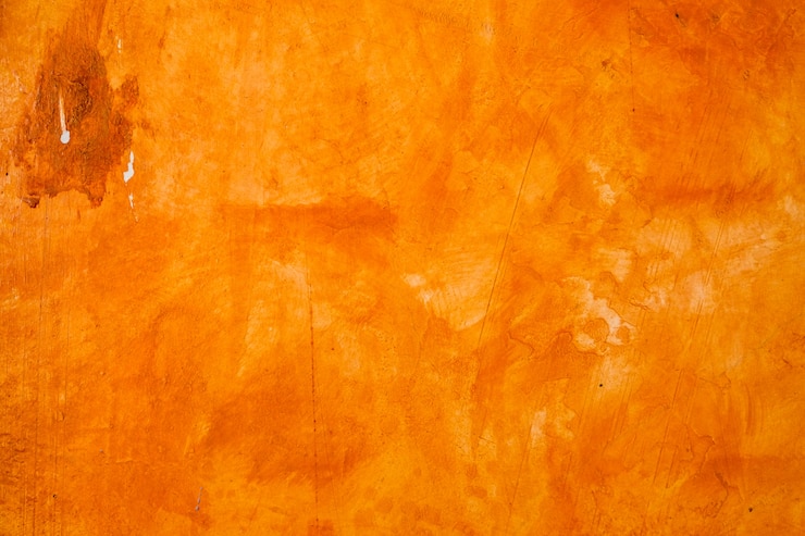 Foto la pared texturizada cepillada el fondo pintado, color de aceite anaranjado abstracto.