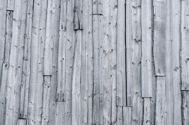 Pared de las viejas tablas grises dañadas por el clima Fondo de madera vintage