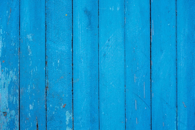 Pared de viejos tableros azules con pintura raída - fondo o textura