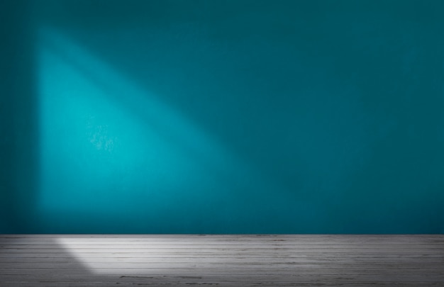 Parede azul em uma sala vazia com chão de concreto