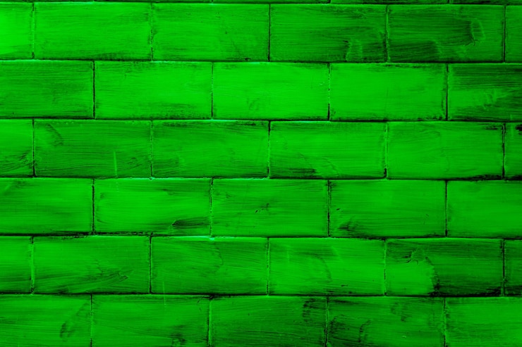 Foto parede com tijolos texturizados e coloridos em verde