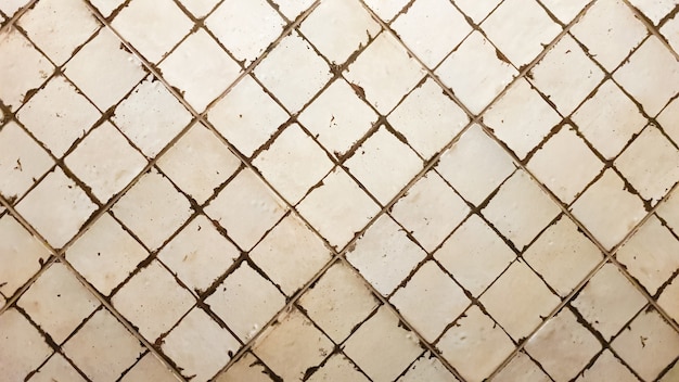 Parede de azulejos. Antigo fundo de telhas brancas. Antigos ladrilhos quadrados de cerâmica para uso interno e externo com acabamento brilhante e fosco.