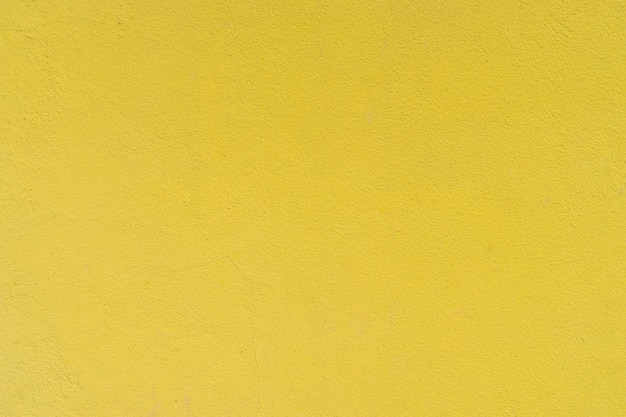 Foto parede de cimento concreto de textura grunge amarelo para plano de fundo