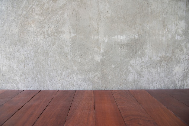 Parede de concreto de cimento para espaço de cópia e antigo padrão de piso retrô de madeira marrom