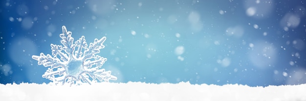 Foto parede de natal com um floco de neve decorativo na neve brilhante