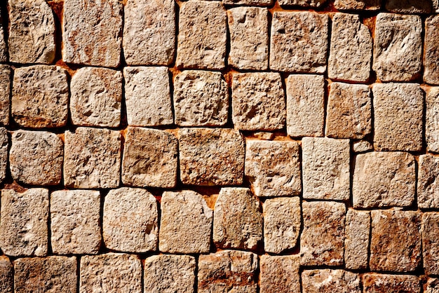 Parede de pedra das antigas pirâmides maias em Uxmal México