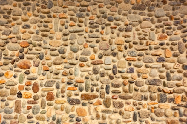 Foto parede de pedra de mosaico de seixos artesanal