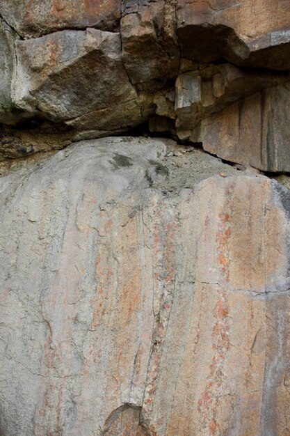 Parede de pedra marrom áspera Textura de pedra de pedra velha superfície resistida Closeup