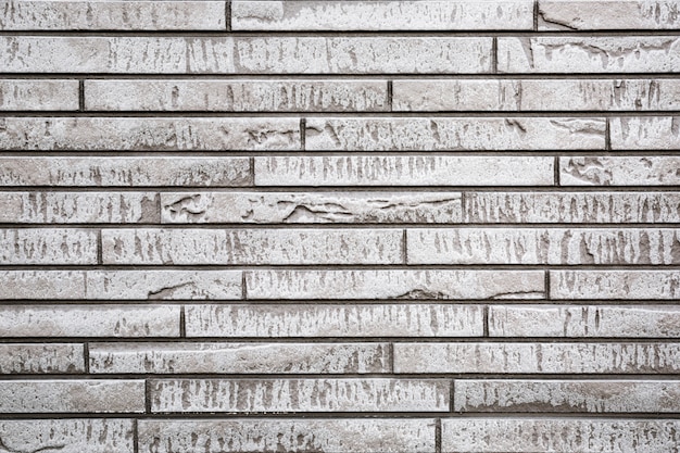 Foto parede de pedra moderna cinzenta para o uso como o fundo ou a textura.