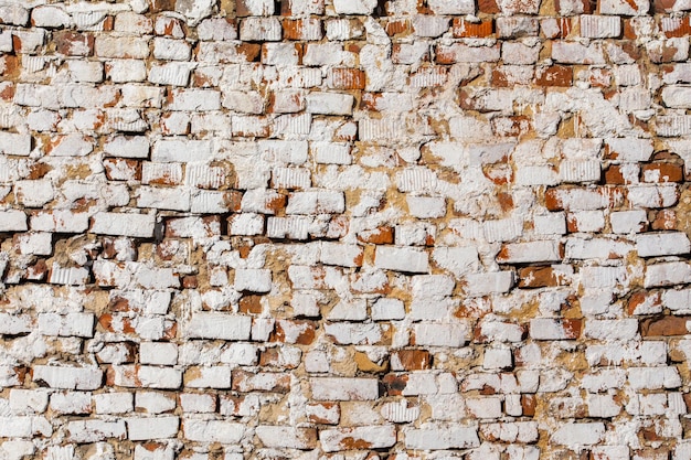 Parede de tijolos antigos com fundo e textura de quadro completo de gesso branco