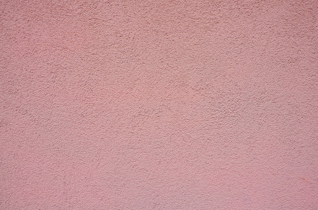 Parede gessada com textura de fundo rosa áspero