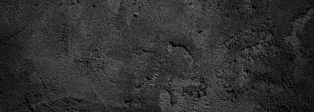 Parede preta assustador ou fundo de textura de pedra granulada áspera cinza escuro Concreto preto para fundo