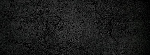 Parede preta assustador ou fundo de textura de pedra granulada áspera cinza escuro Concreto preto para fundo