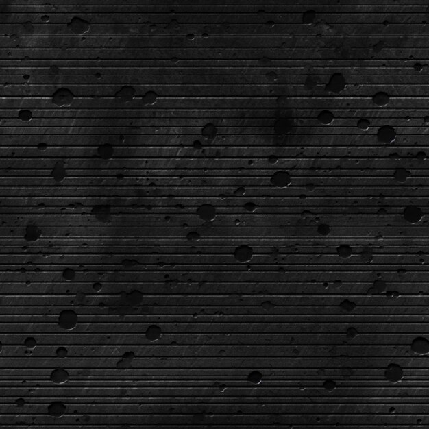 Foto parede preta com fundo preto e superfície texturizada.