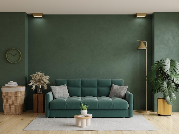 Parede verde simulada em tons escuros com sofá verde e decoração mínima