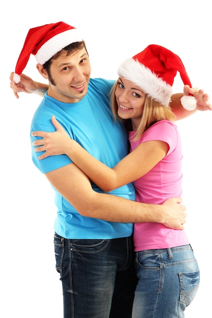 Pareja amorosa con sombreros de Santa en blanco