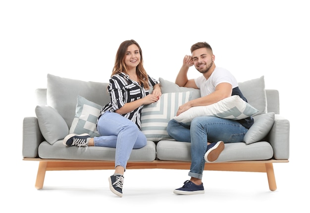 Foto pareja joven, sentado, en, sofá, contra, blanco