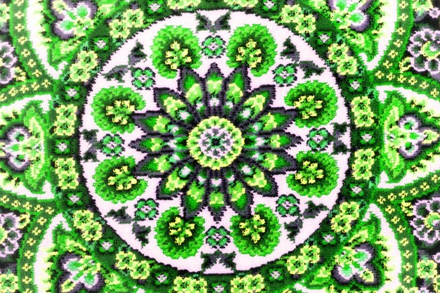 Parte do tapete tecido áspero fechado Padrões abstratos verdes Fundo simétrico