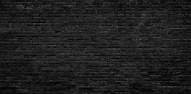 Parte horizontal de la pared de ladrillo pintada de negro