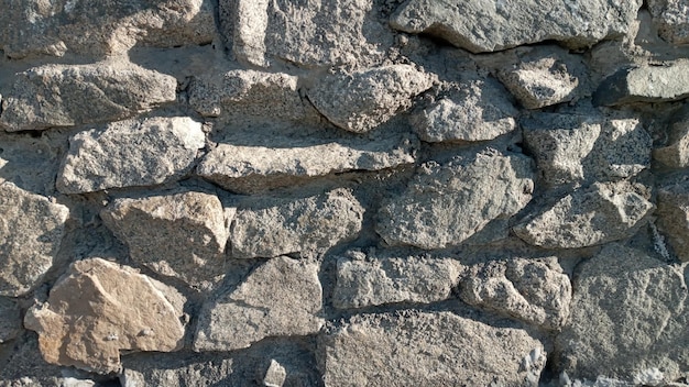 Parte de un muro de piedra de fondo o textura