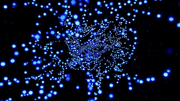 Foto partículas azules brillantes que fluyen con gracia contra un fondo oscuro creando una experiencia visual cautivadora y dinámica que hipnotiza con su energía y movimiento