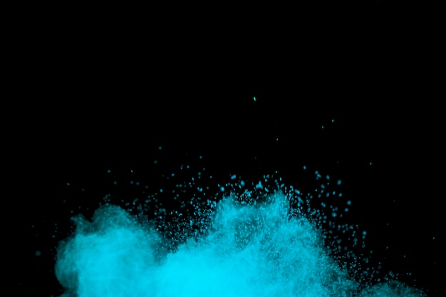 Foto partículas de poeira colorida azul