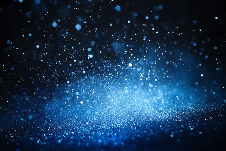 Particulas mágicas de polvo azul brillante en un fondo oscuro