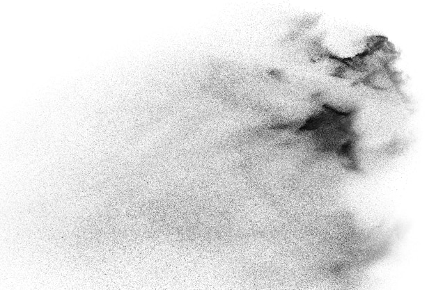 Foto partículas negras salpicadas sobre fondo blanco.