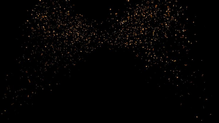 Partículas de oro en un fondo negro
