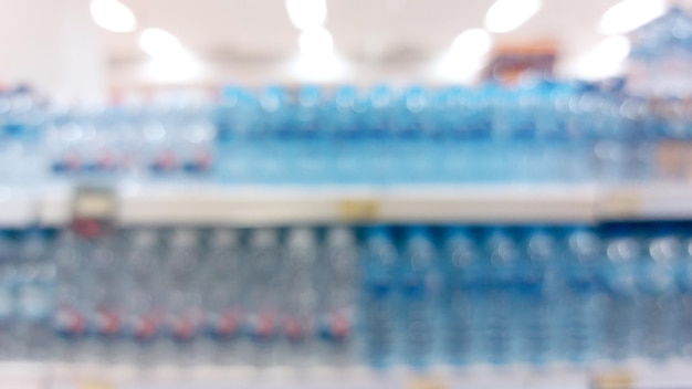 pasillo del supermercado y estantes desdibujado fondo tienda de comestibles concepto de negocio minorista