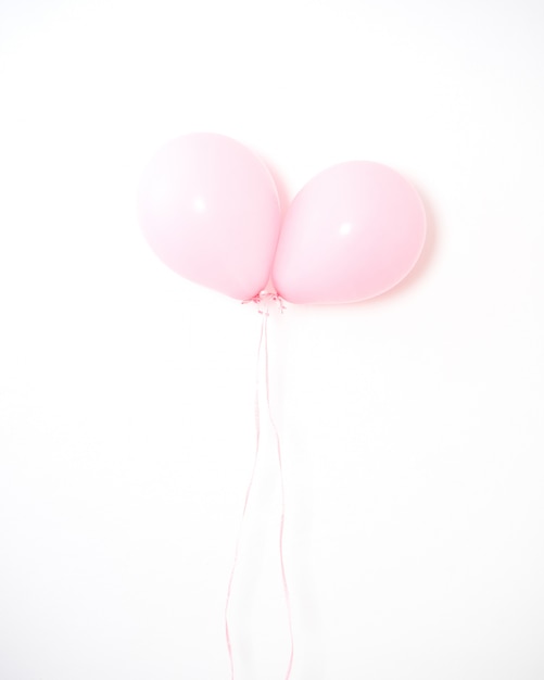 Foto pastel cor-de-rosa do balão em cinzento