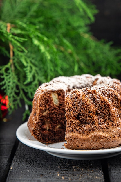 Pastel de Navidad dulces tartas caseras postre año nuevo bizcocho de chocolate fondo de alimentos rústico