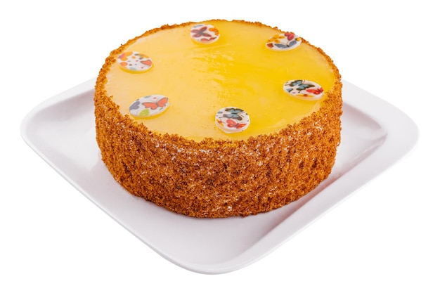 Pastel de zanahoria en glaseado amarillo en placa