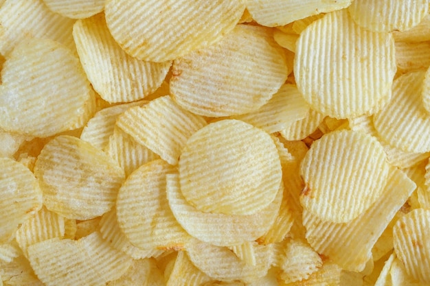 Patatas fritas crujientes snack textura del fondo
