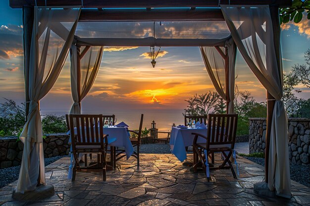 un patio con vistas al océano y la puesta de sol