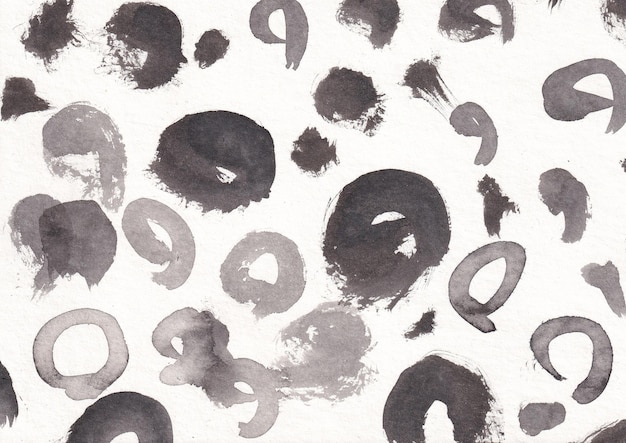 Foto patrón abstracto monocromático con manchas de tinta negra y manchas en un fondo de papel blanco texturizado ideal para diseños creativos