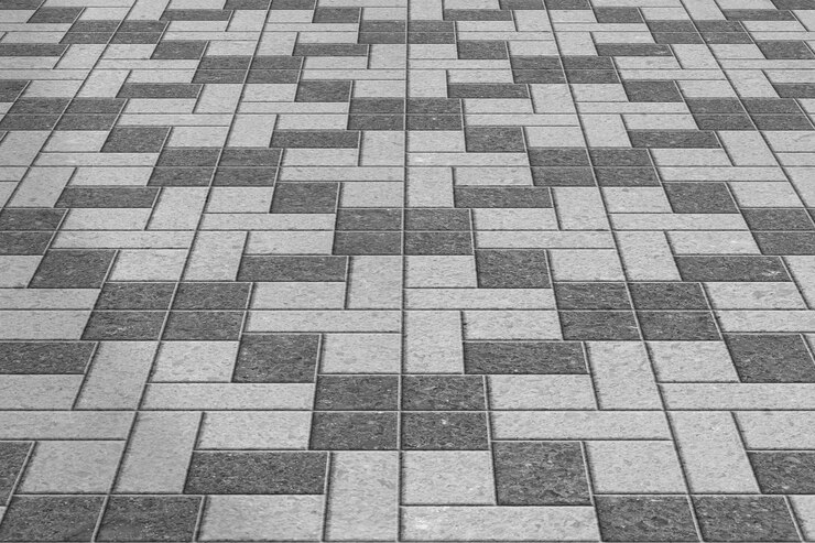 Patrón de adoquines de acera gris.