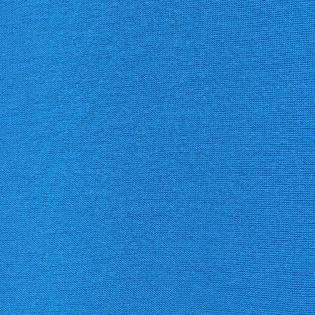 Patrón de bufanda de lana de tela simple azul celeste de invierno. Textura de suéter de lana de color azul.