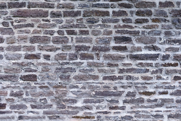 Patrón de color gris de diseño de estilo moderno decorativo irregular agrietado superficie de pared de piedra real con cemento